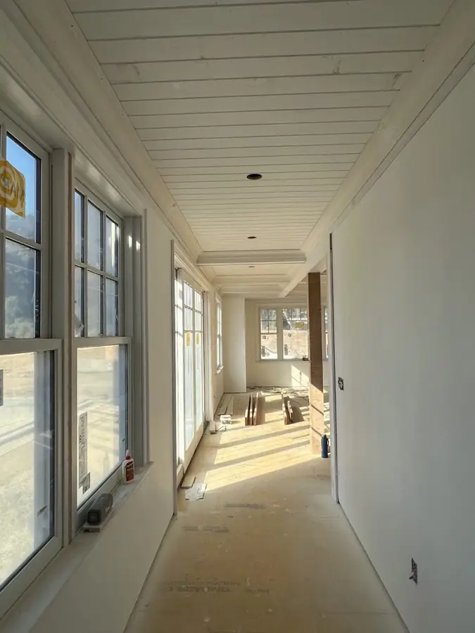 Light-filled passage finished by Pandora Group LLC.