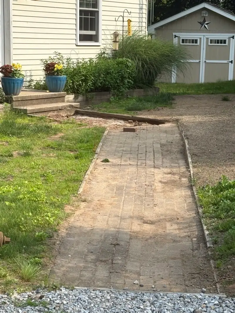 Walkway demolition and masonry base preparation by Pandora Group LLC.