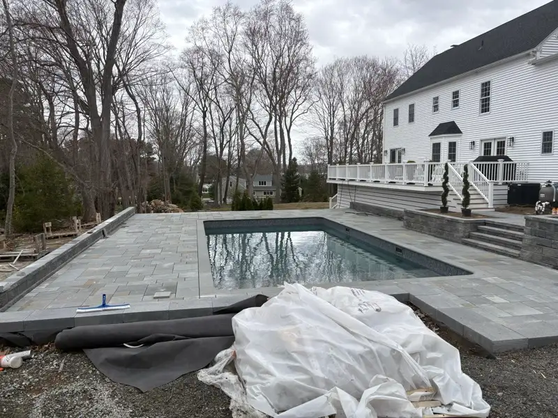 Finished pool surround paving by Pandora Group LLC.