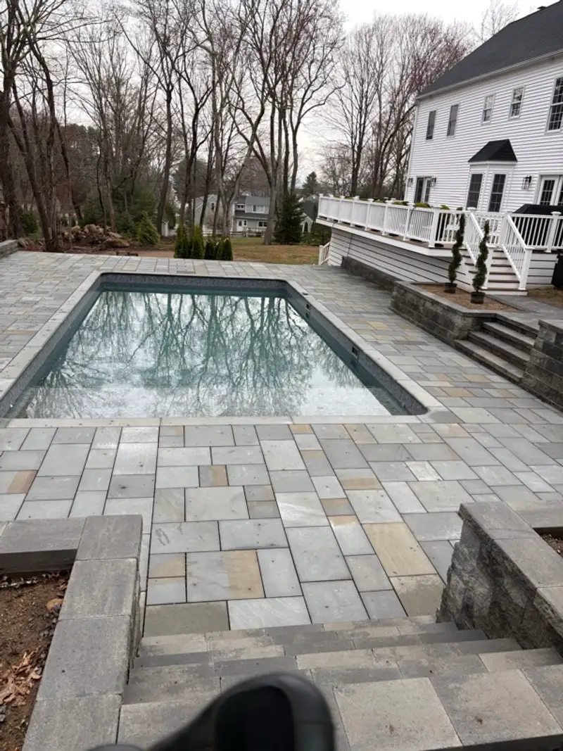 Pool deck stair approach and paver alignment detail by Pandora Group LLC.