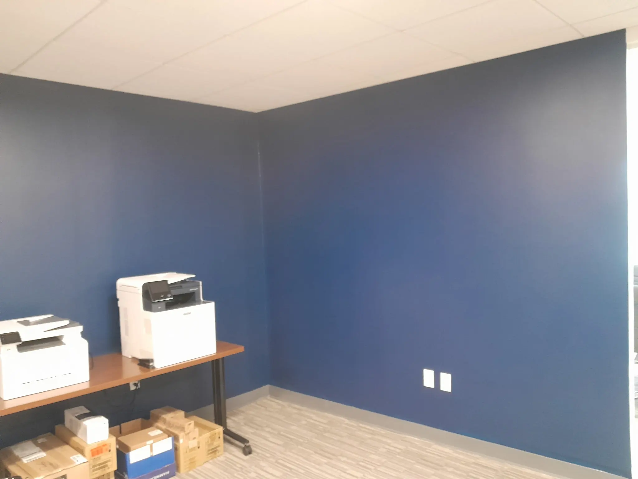 Blue wall paint finish in an office interior.
